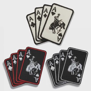 May include: Three sets of playing card patches featuring the Ace of Spades, Hearts, Diamonds, and Clubs. Each patch has a black and white design, with a cowboy riding a horse on the Ace of Spades. The patches are rectangular.
