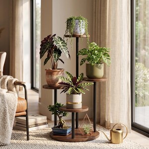 May include: A multi-tiered plant stand featuring a central black metal pole and circular dark wood shelves. The stand holds six various potted plants, including a trailing succulent, a bonsai, and leafy green foliage in ceramic pots.