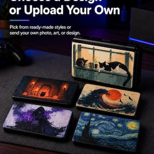 May include: A black handheld gaming console with interchangeable lids featuring various artistic designs, including cats on a windowsill, a dark dungeon, a large wave with a red sun, a hooded figure, and a starry night sky. Text reads: Choose a Design or Upload Your Own.