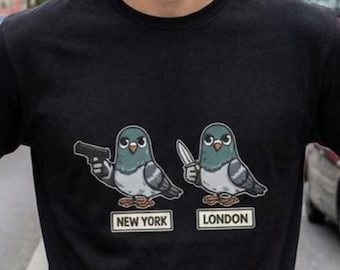 Camiseta divertida de paloma: Camiseta con meme urbano de Nueva York vs Londres, gráfico de pájaro de dibujos animados.