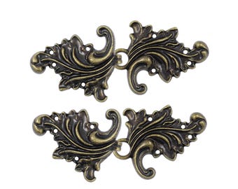 4 Pairs Sew On Asymmetric Acanthus Leaf Cape or Cloak Clasp Fasteners. 66mm x 28mm Fastened. (Antique Brass)(MTN7484-AB)