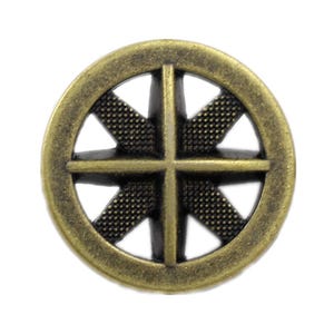 May include: A circular metal button with an antique brass finish, featuring a cross-shaped design with four spokes radiating from the center. The interior sections between the spokes have a textured, dotted surface, creating a contrast.