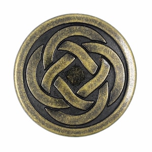 May include: A circular metal button featuring an antique brass finish with a raised, intertwined knot pattern set against a recessed, dark black background. The design consists of four interlocking loops forming a central square shape.