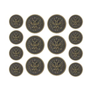 Metallknappset med dubbla kavajknappar och två hövdade örnar. 6 st à 25 mm, 8 st à 18 mm (antikmässing) (MTN3006-AB)