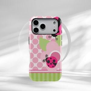 May include: Pink and green phone case featuring a ladybug design. The case has a pink polka dot pattern, a pink flower, and a green striped bottom. The ladybug is red with black spots.