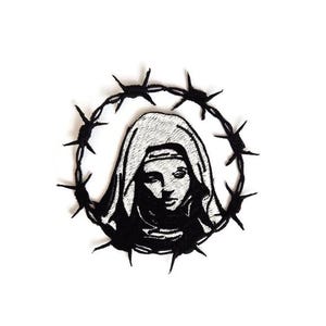 May include: Embroidered patch in black and white, depicting a religious figure encircled by barbed wire. The figure has a calm expression and wears a head covering. The patch is set against a white backdrop.