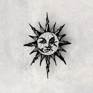 May include: Embroidered patch featuring a celestial design of a smiling sun with a crescent moon overlay. The sun has pointed rays and a detailed face, rendered in black and white. Ideal for jackets, bags, or other fabric items.