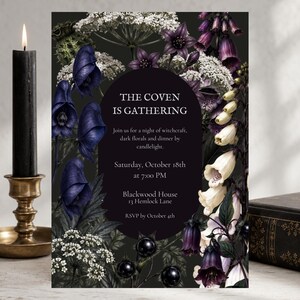 May include: A rectangular invitation card featuring a dark background with botanical illustrations of purple monkshood, white yarrow, and foxglove flowers. The text reads: THE COVEN IS GATHERING, Join us for a night of witchcraft, dark florals and dinner by candlelight, Saturday, October 18th at 7:00 PM, Blackwood House 13 Hemlock Lane, RSVP by October 4th.