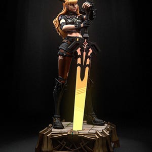 May include: A detailed figurine of a female warrior with blonde hair, wearing black armor and holding a glowing sword. The figure stands on a decorative base with a gold and brown finish. The sword emits a bright yellow light.
