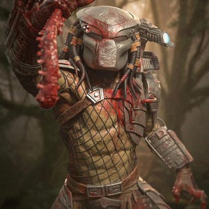 May include: A detailed action figure of a Predator, featuring a bio-mask, dreadlocks, and intricate armor. The figure is predominantly gray, red, and tan, with a net-like pattern on the torso. The figure is holding a weapon, with a forest background.