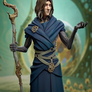 May include: A digital art illustration of a figure in a flowing blue robe, holding a staff with gold accents. The figure has brown hair and is set against a blurred, abstract background with a teal and gold color scheme.