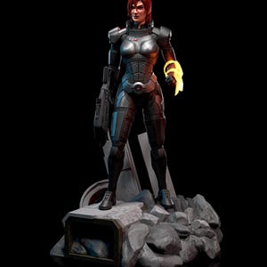 May include: A detailed figurine of a female character in a futuristic armored suit, standing on a rocky base. The figure has red hair and a determined expression. The armor is primarily grey with red accents, and a glowing yellow energy effect emanates from one hand.