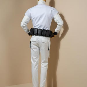 May include: A distressed wooden sign, inscribed with 'Welcome to our home' in white. The sign has a rustic appearance, ideal for a porch or hallway, and is designed with a simple, welcoming aesthetic.