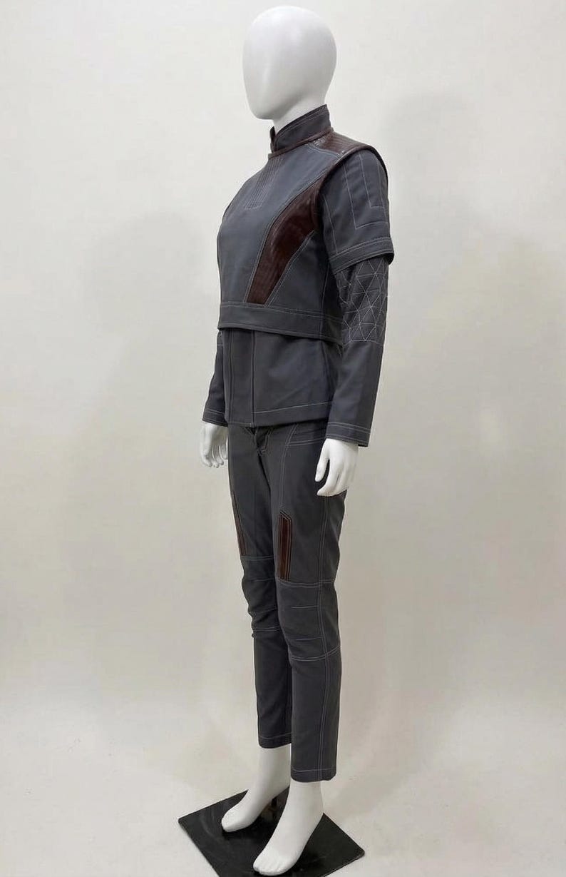 May include: A white ceramic mug with a black handle and the text "But First, Coffee" in a black, bold font. The mug is sitting on a wooden surface. The mug is approximately 4 inches tall.