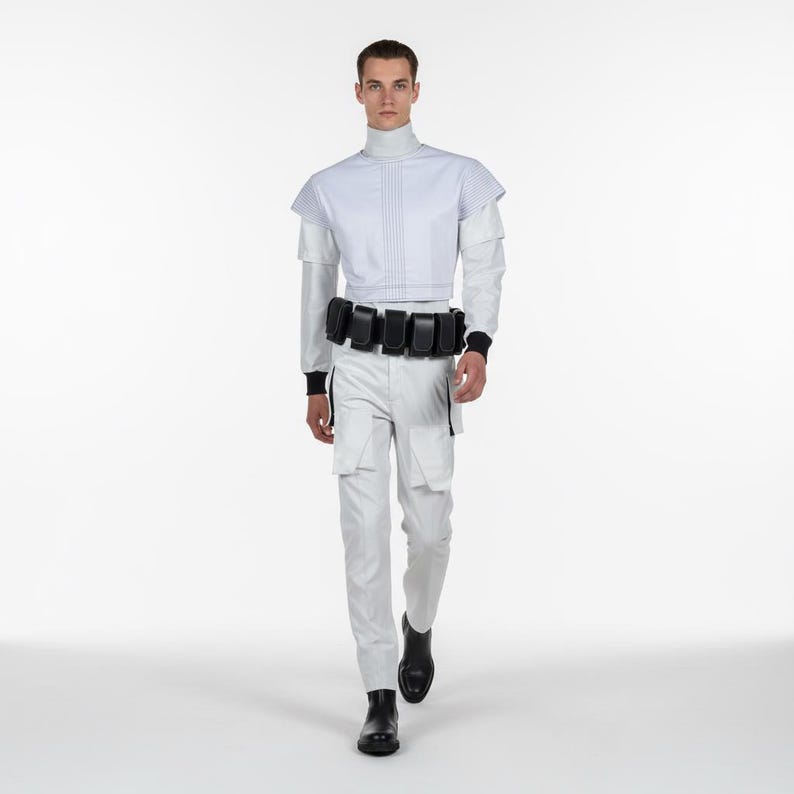 May include: A futuristic outfit in white and black. The ensemble features a high-collared top with vertical lines, white cargo pants, and a black belt with pouches. The outfit is completed with black boots.