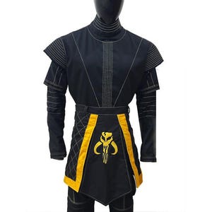 May include: Black costume with gold detailing, shown on a mannequin. The outfit includes a high collar, shoulder accents, and a belt. A gold emblem is on the front. The costume is suitable for cosplay or themed events.