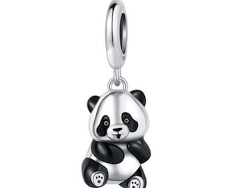 May include: A silver panda charm with black and white enamel details. The charm features a panda bear design with a loop at the top for attaching to a bracelet or necklace. The panda is in a sitting position.