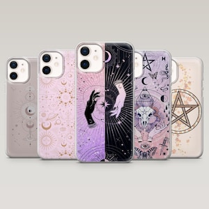 May include: Five phone cases with mystical designs. The cases feature illustrations of hands, moons, stars, and other occult symbols in pink, purple, and black. The cases are made of a clear, protective material, suitable for various phone models.