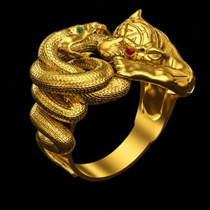 May include: A gold ring depicting a snake entwined with a tiger. The snake has a green gemstone eye, and the tiger has red gemstone eyes. The ring is set against a black backdrop.