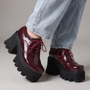 Patent leather platform pumps chunky block heel lace-up closure deep lug sole women statement footwear gothic party heels ankle height reinforced eyelet construction cushioned insole