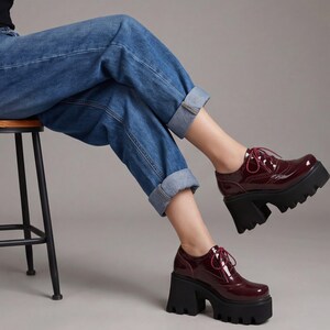 Patent leather platform pumps chunky block heel lace-up closure deep lug sole women statement footwear gothic party heels ankle height reinforced eyelet construction cushioned insole