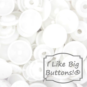 May include: A close-up image of a pile of white plastic buttons. The buttons are various sizes and shapes. The text "I Like Big Buttons!&reg;" is visible in the lower right corner of the image.