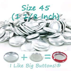 May include: A pile of silver metal snap buttons, size 45 (1 1/8 inch). The buttons are arranged in a pile, with some buttons stacked on top of others. The buttons are all the same size and shape, and they have a smooth, shiny surface.