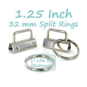 May include: Silver-colored split rings and clasps. The image shows two metal clasps with a handle and several split rings. Text in the image reads "1.25 Inch 32 mm Split Rings" and "I Like Big Buttons".