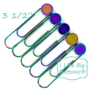 May include: Six iridescent rainbow paper clips with large, round, iridescent rainbow buttons attached. The buttons are 3 1/2 inches in diameter. The text "I Like Big Buttons!" is printed on a white background with a blue border.