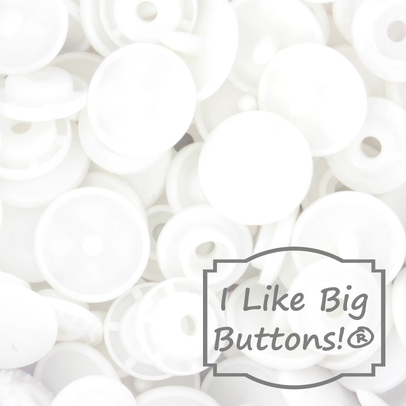 May include: A close-up image of a pile of white plastic buttons. The buttons are various sizes and shapes. The text "I Like Big Buttons!&reg;" is visible in the lower right corner of the image.