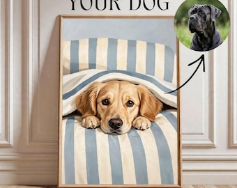 May include: A framed vertical wall art print featuring a golden retriever resting under a blue and white striped blanket. Above the print, the text reads YOUR DOG. A circular inset shows a black dog with an arrow pointing to the main image.
