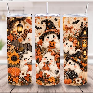 May include: A cylindrical tumbler with a clear lid and straw, featuring a repeating pattern of white ghosts, orange pumpkins, sunflowers, and autumn leaves. The design includes black witch hats, bats, a lantern, and a house, all set against a quilted background.