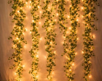 Guirnalda de luces LED con forma de hiedra: hojas de seda realistas, luz blanca cálida, decoración flexible.