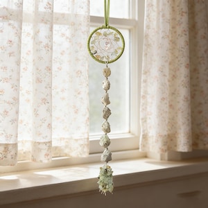 May include: A set of three ceramic mugs with a speckled, matte finish. The mugs are in shades of cream, light gray, and dark gray. Each mug has a simple, minimalist design, perfect for coffee or tea.