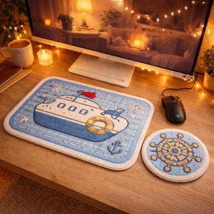 May include: A white ceramic mug with a black handle and the text "But First, Coffee" in a bold, black font. The mug is on a wooden surface. The mug is 10 cm tall.