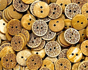 May include: A collection of round, wooden buttons with intricate designs. The buttons are in shades of brown and beige, with some having a natural wood finish and others having a painted design. The buttons are all different sizes and shapes, and they are arranged in a random pattern.