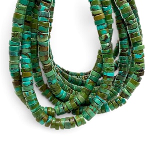 May include: A multi-strand necklace composed of numerous small, flat, disc-shaped beads in varying shades of turquoise, teal, and olive green. Each bead features natural dark brown matrix veining, creating a textured, earthy appearance throughout the strands.