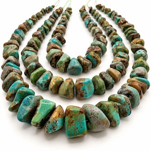 May include: Three strands of turquoise beads arranged in a nested formation. Each strand features irregular, tumbled turquoise stones displaying a mix of vibrant blue-green hues and dark brown matrix veining, strung together on thin, light-colored cord.