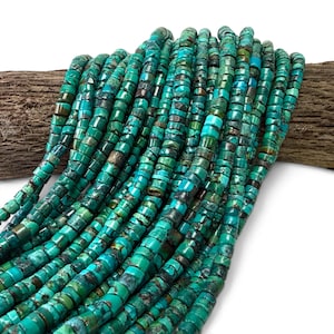 May include: A collection of small, cylindrical turquoise beads arranged in multiple parallel strands. The beads feature a vibrant mix of bright teal, deep blue, and dark brown matrix patterns, creating a textured appearance across the surface.