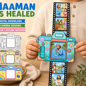 May include: A paper craft camera with a sliding film strip depicting the biblical story of Naaman is healed. The camera features colorful illustrations of sea life and a central window showing a man in water. Text includes NAAMAN IS HEALED.