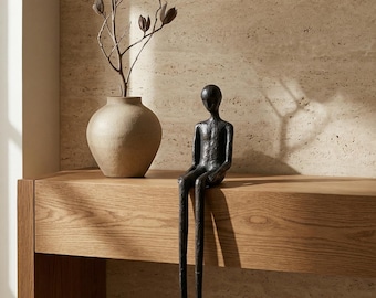Escultura de metal negro sentada – Figura decorativa abstracta moderna de piernas largas