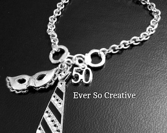 Silver Plated Charm Bracelet: Tie, Mask, Handcuff Charms