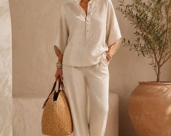 Elegantes Leinen-Ensemble, minimalistisches Outfit aus weißem Hemd und Hose, mediterrane Resortmode, stilvolles Sommer-Ensemble für entspannte Urlaubszeit.