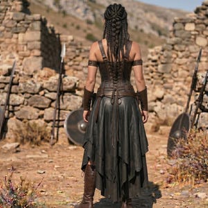 May include: A dark brown leather corset with back lacing, paired with a layered black skirt. The outfit includes matching brown leather arm guards and upper arm bands. The ensemble is completed with tall brown leather boots, showcasing a structured design with multiple straps and ties visible from the back view.
