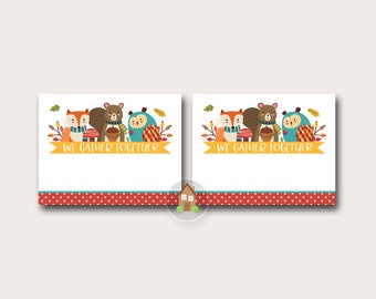 May include: Two printable Thanksgiving place cards with a white background. Each card features a fox, squirrel, and owl with fall foliage. The text "WE GATHER TOGETHER" is on a yellow banner. A red polka dot border is at the bottom.