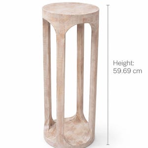 May include: A light-colored wooden plant stand. The stand is cylindrical with a round top and base, supported by four vertical, arched supports. The diameter is 8 inches, and the height is 23.5 inches.