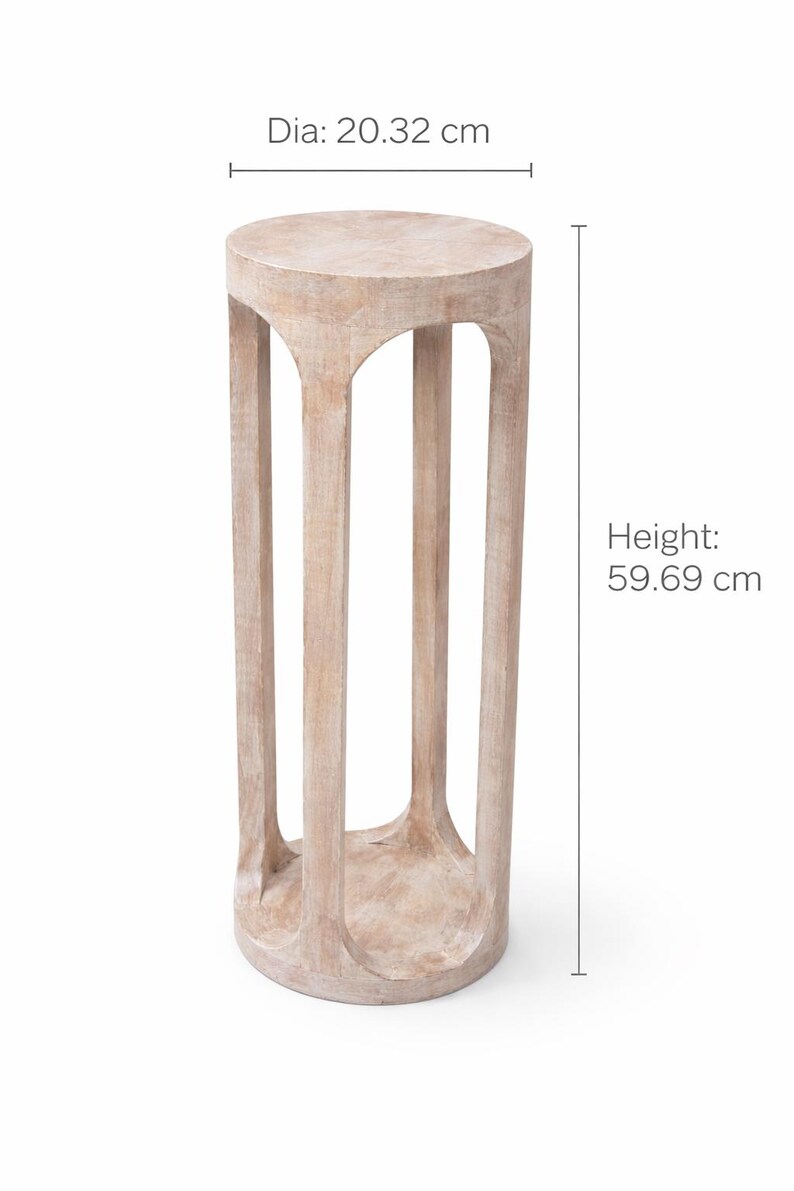 May include: A light-colored wooden plant stand. The stand is cylindrical with a round top and base, supported by four vertical, arched supports. The diameter is 8 inches, and the height is 23.5 inches.