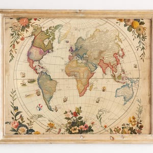 May include: A framed vintage world map print. The map features a detailed depiction of the world in muted tones. Floral decorations in pink, yellow, and orange adorn the edges, set within a light-coloured wooden frame.