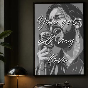 May include: Black and white framed art print featuring a singing man holding a vintage microphone. The artwork has the text "You got all my love" in a cursive font. The image is a grayscale illustration.