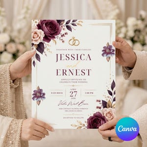 Könnte beinhalten: Eine Hochzeitseinladungskarte mit dunkelroten und zartrosa Blumenillustrationen, goldenen Ring-Symbolen und eleganter Serifenschrift. Der Text lautet Jessica and Ernest, Saturday April 27 2026, 5:00 PM, Vista West Barn, 4020 Central Florida Parkway.